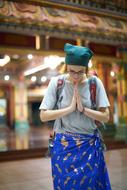 tourist is praying in a temple in Cambodia