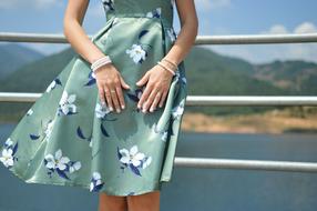 girl in a blue dress on the bridge