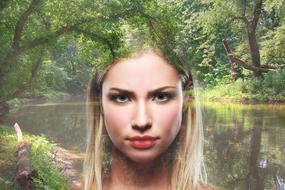 woman's face on the background of a forest lake