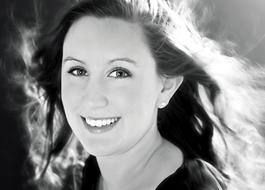 monochrome photo of a happy brunette