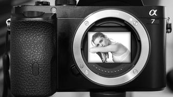 woman in the lens of a sony camera