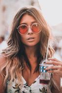 photo of a girl with a drink in a glass