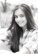 portrait of a beautiful teen girl in black and white blurred background