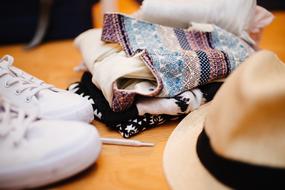 Colorful clothes, shoes and fedora hat, on the still life