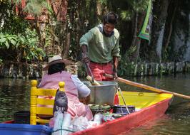 a couple of people working in a boat