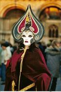 Portrait of a person in colorful and beautiful mask and costume in Venice, Italy