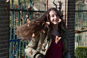 portrait of happy Teen Girl with autumn leaves