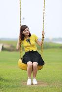 Asian girl on a swing