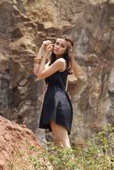 Woman Fashion Model on cliff