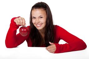 girl in a red sweater with an apple in her hand