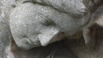 stone Sculpture, sad human face