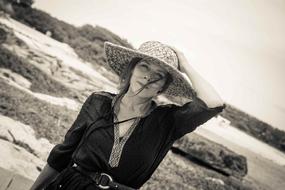 Woman With Straw Hat At The