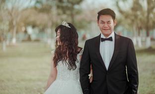 happy groom with bride in asia