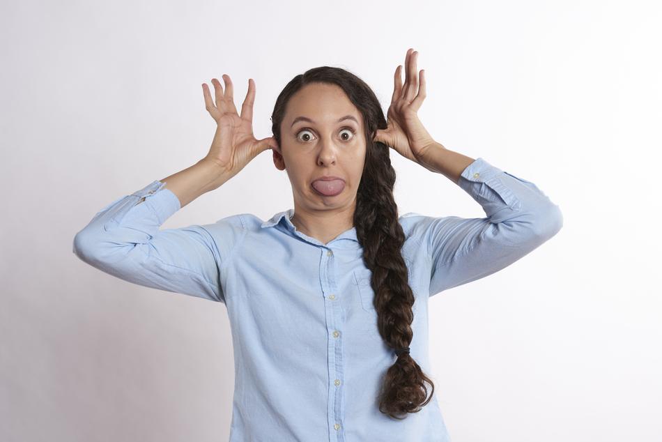 pigtailed woman fooling around