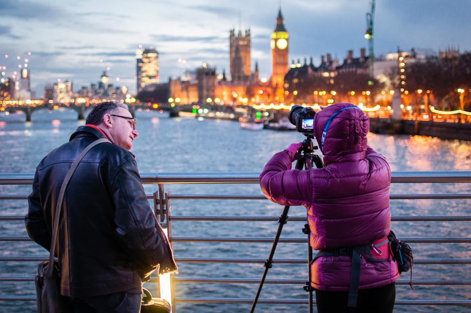 photographer on the bridge near the river
