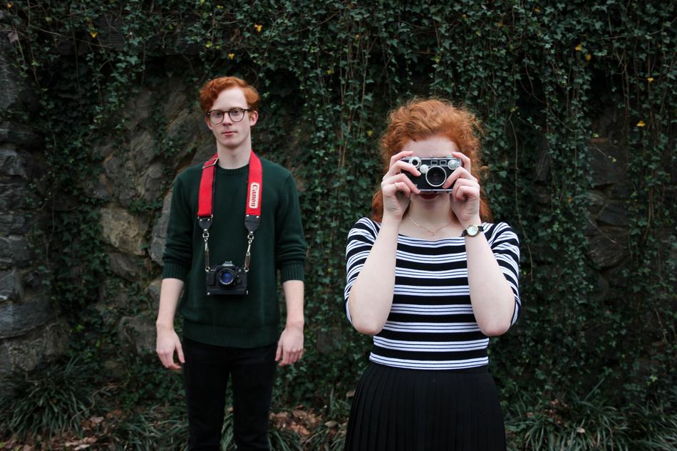 a guy and a girl with red hair