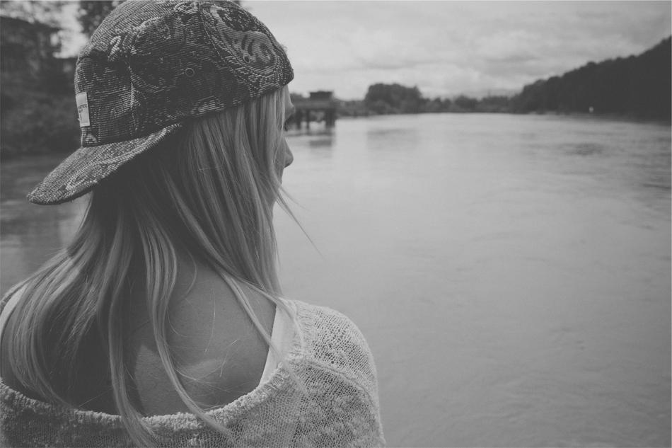 monochrome photo of Young Girl Woman on lake