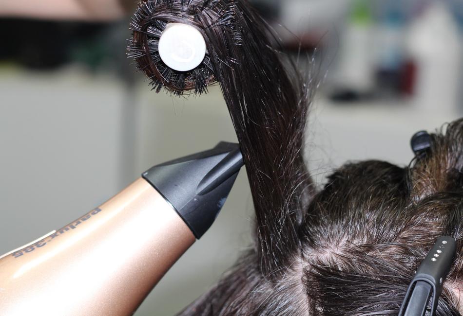 hairdresser with hairdryer