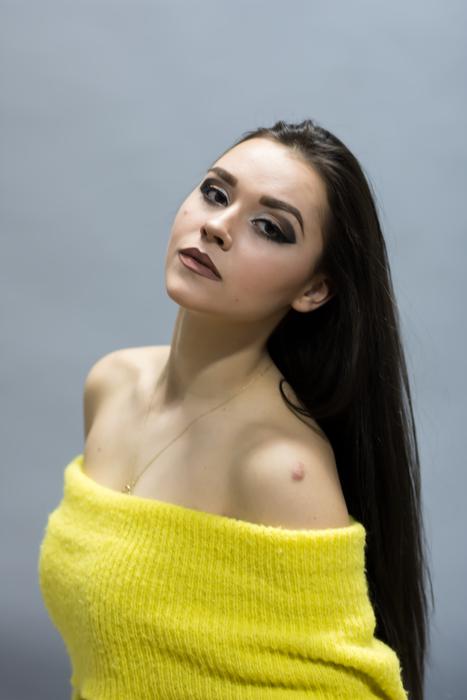 brunette in yellow knitwear