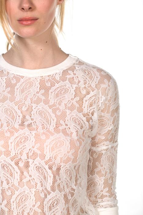 white blouse with patterns on the girl