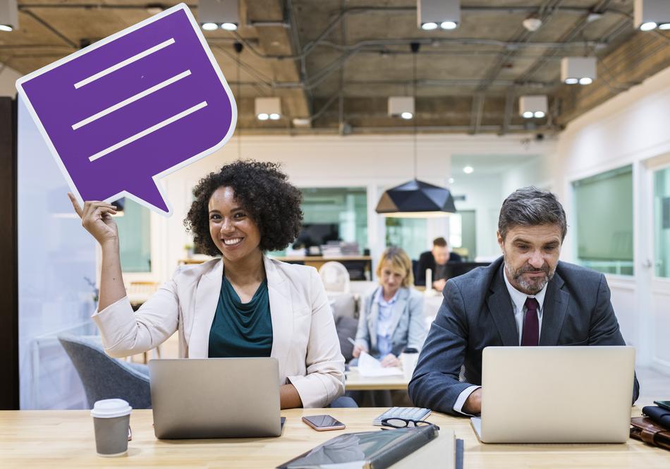 positive manager holding a speech bubble in the office