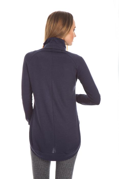 Back view of the woman posing in clothing, at white background