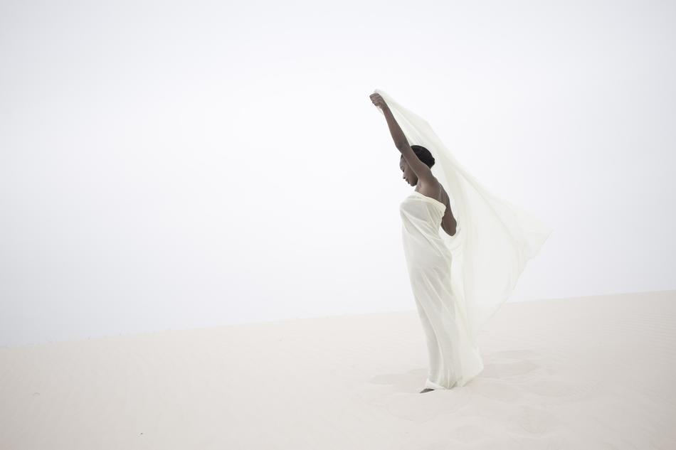 bride in white dress in the desert