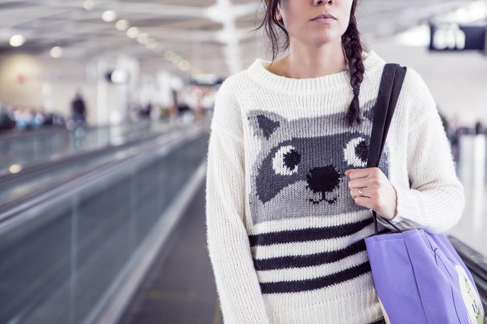 girl with bag on escalator