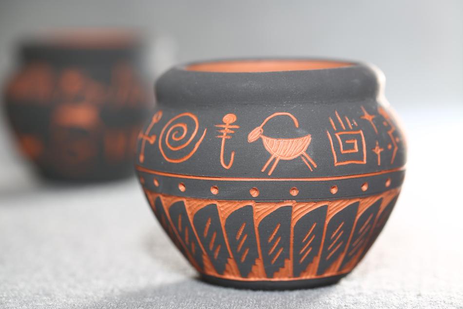 Beautiful and colorful pots with Navajo patterns, in light