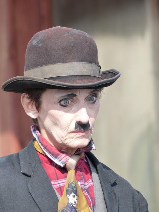 Charlie Chaplin in suit and hat