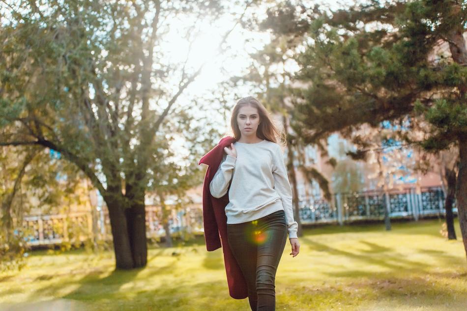 girl with red coat in the park