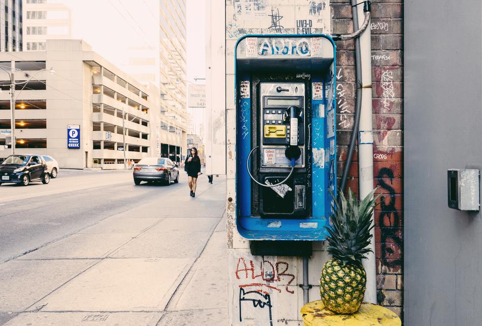 Pineapple on the table near the payphone