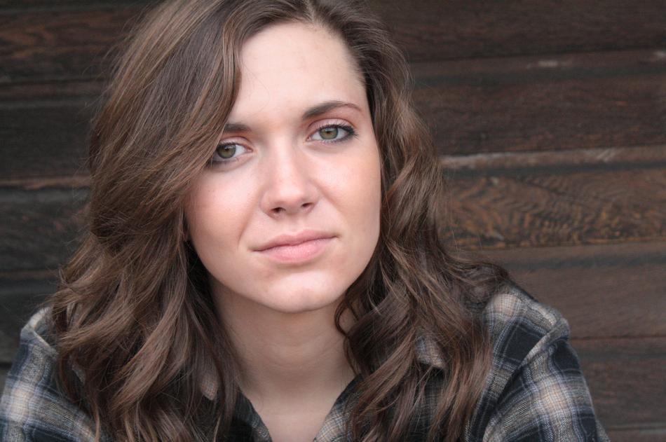 beautiful brunette on a wooden background