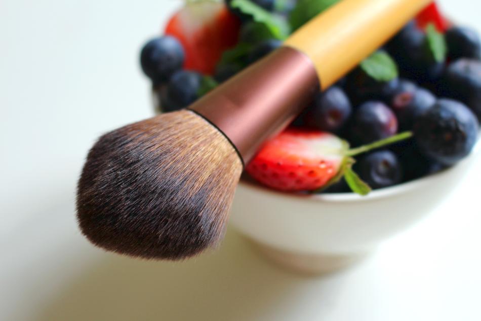 makeup brush on a bowl with berries