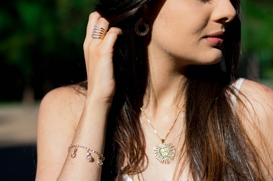 Beautiful woman with the shiny accessories, in sunlight