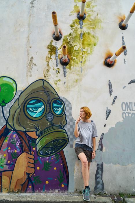 girl with a cigarette on a graffiti background