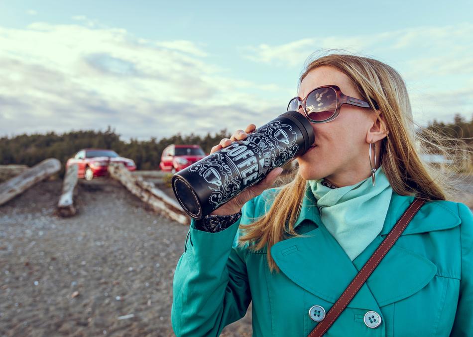 girl with thermos outdoors