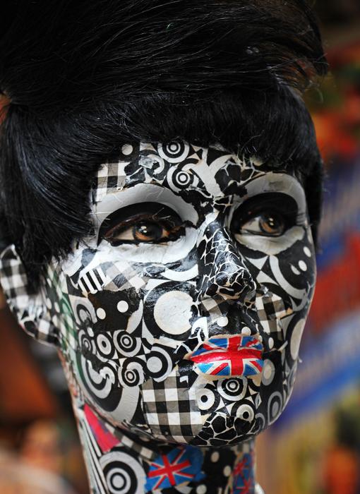 mannequin with colorful makeup close up