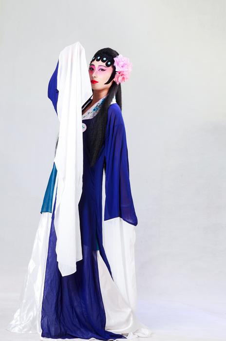 Girl in the beautiful and colorful dress, in the Beijing Opera, in China