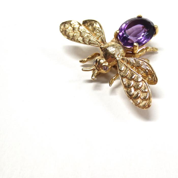 gold beetle brooch with purple stone