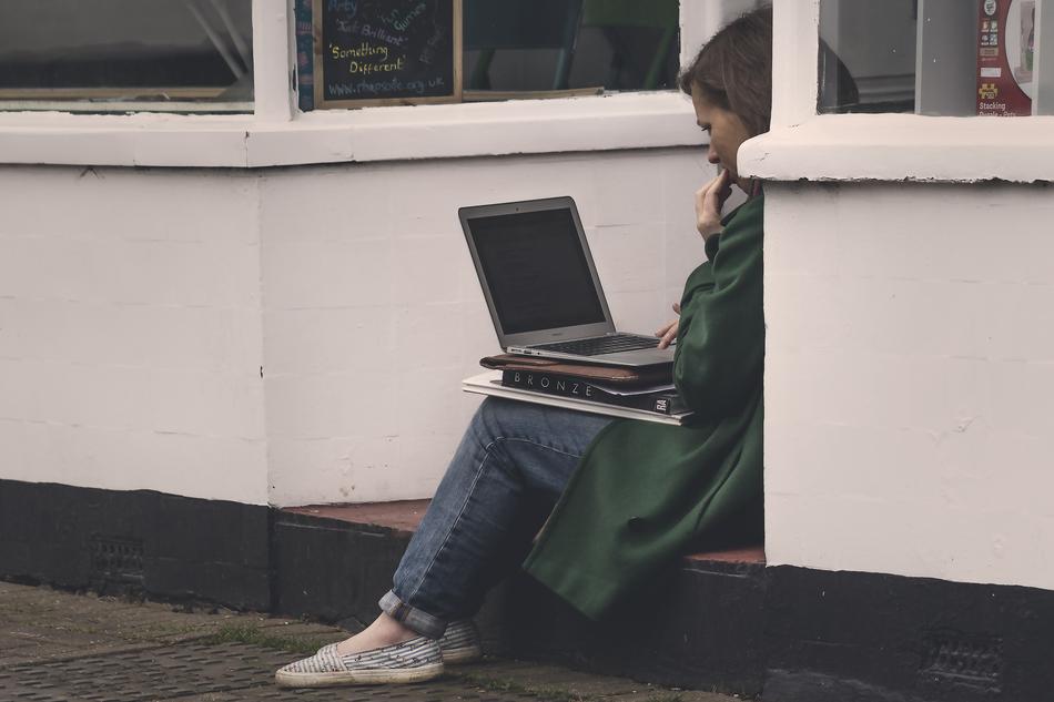 Woman Girlwith laptop on street