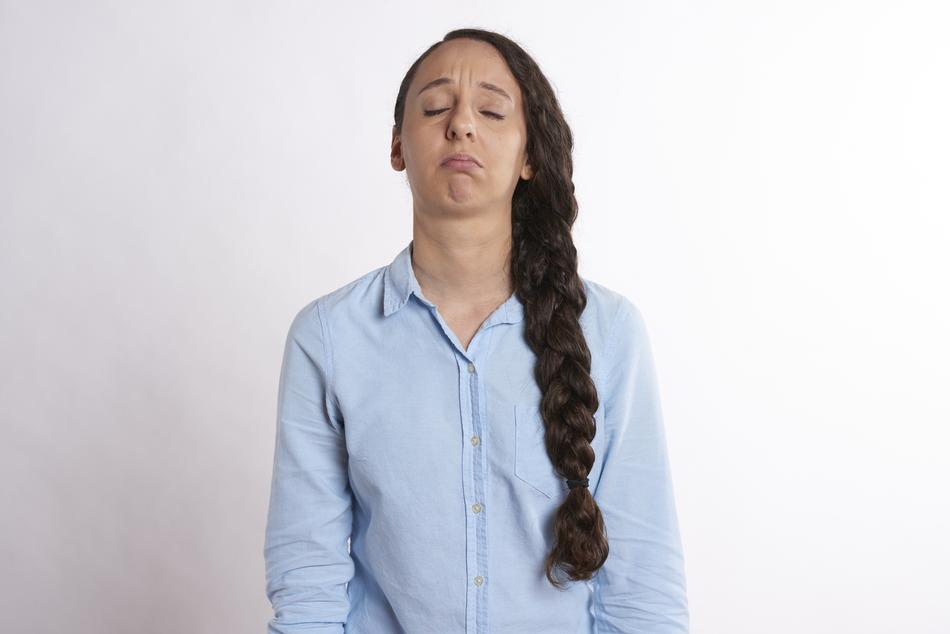 sad woman with thick braid