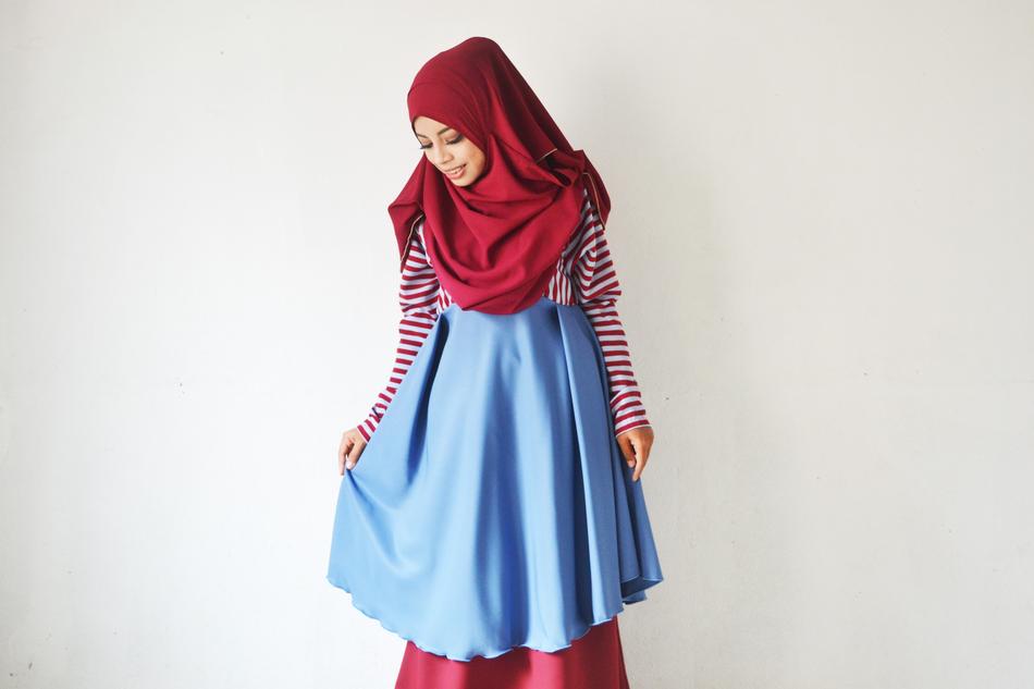 girl in hijab near white wall