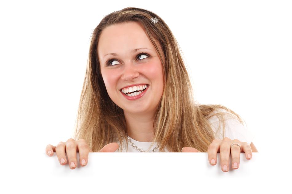 Advertising Banner in the hands of a happy girl