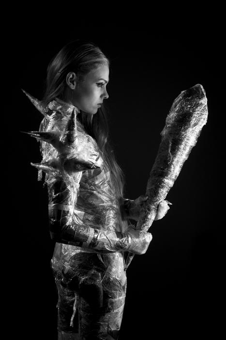 fantastic model in stretch film with a bat