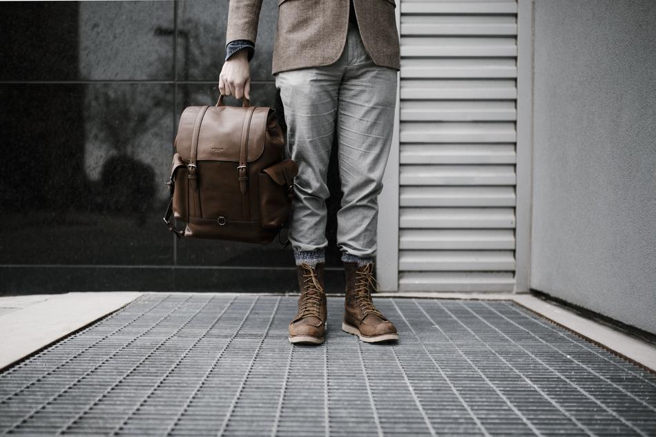 man with leather bag