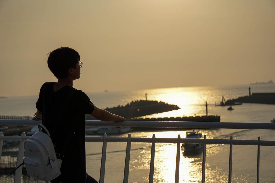 adult Standing on Peek at Sunset