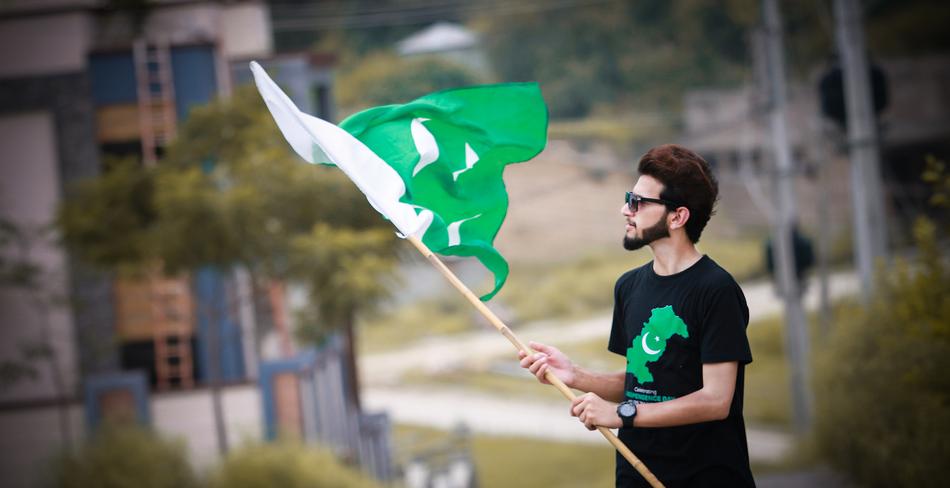 Man with the flag of Pakistan