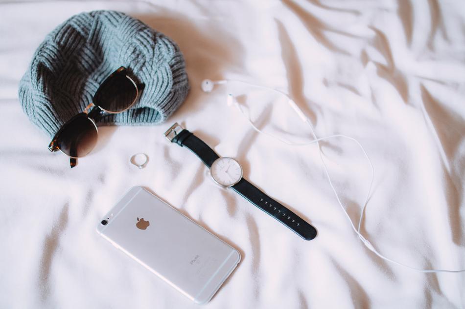 Iphone, dark glasses, hat and wristwatch