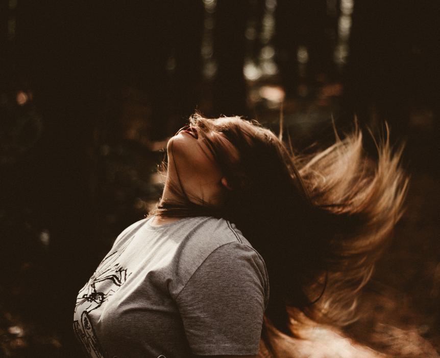 Woman with long winding hair outdoor